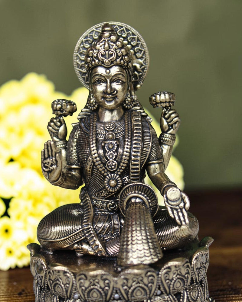 Rigvedaa brass Lakshmi Ganesh idol seated on lotus, intricate detailing, golden finish, 4 inch height.