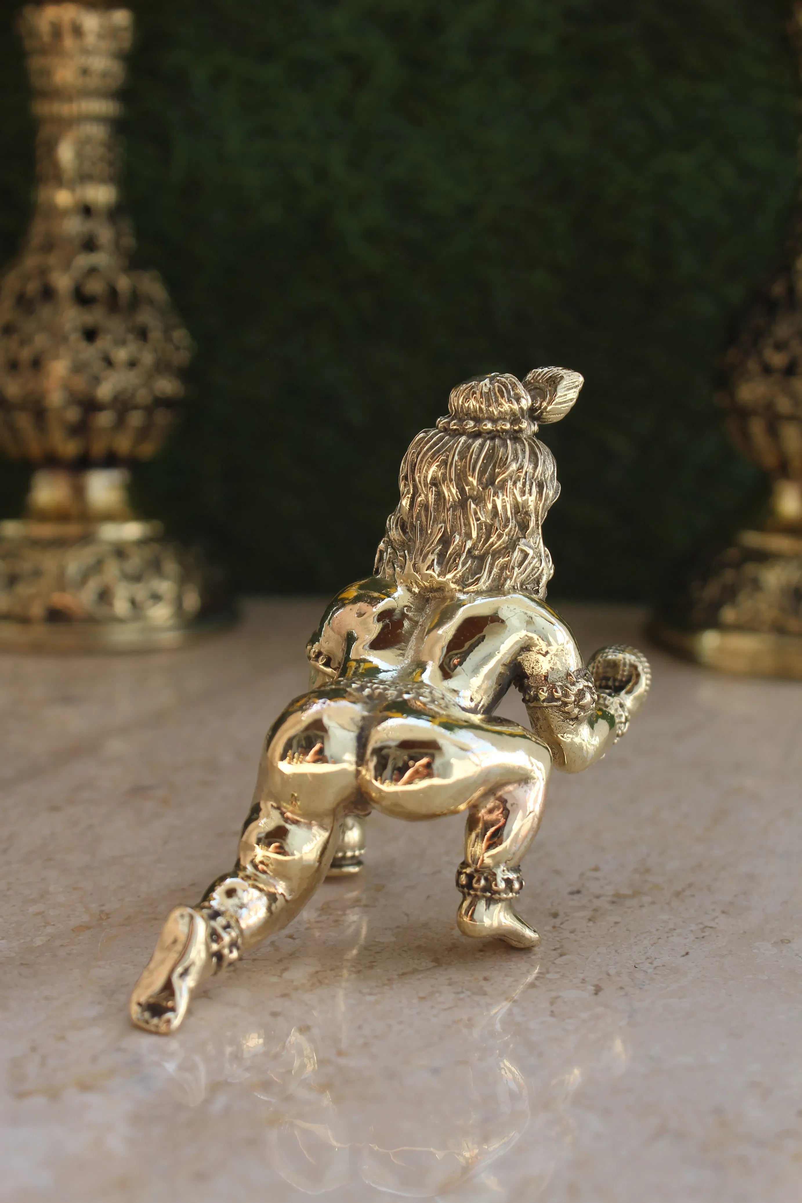 Brass Laddu Gopal Idol close-up back view showing Krishna statue with Laddu in hand and ornamental details