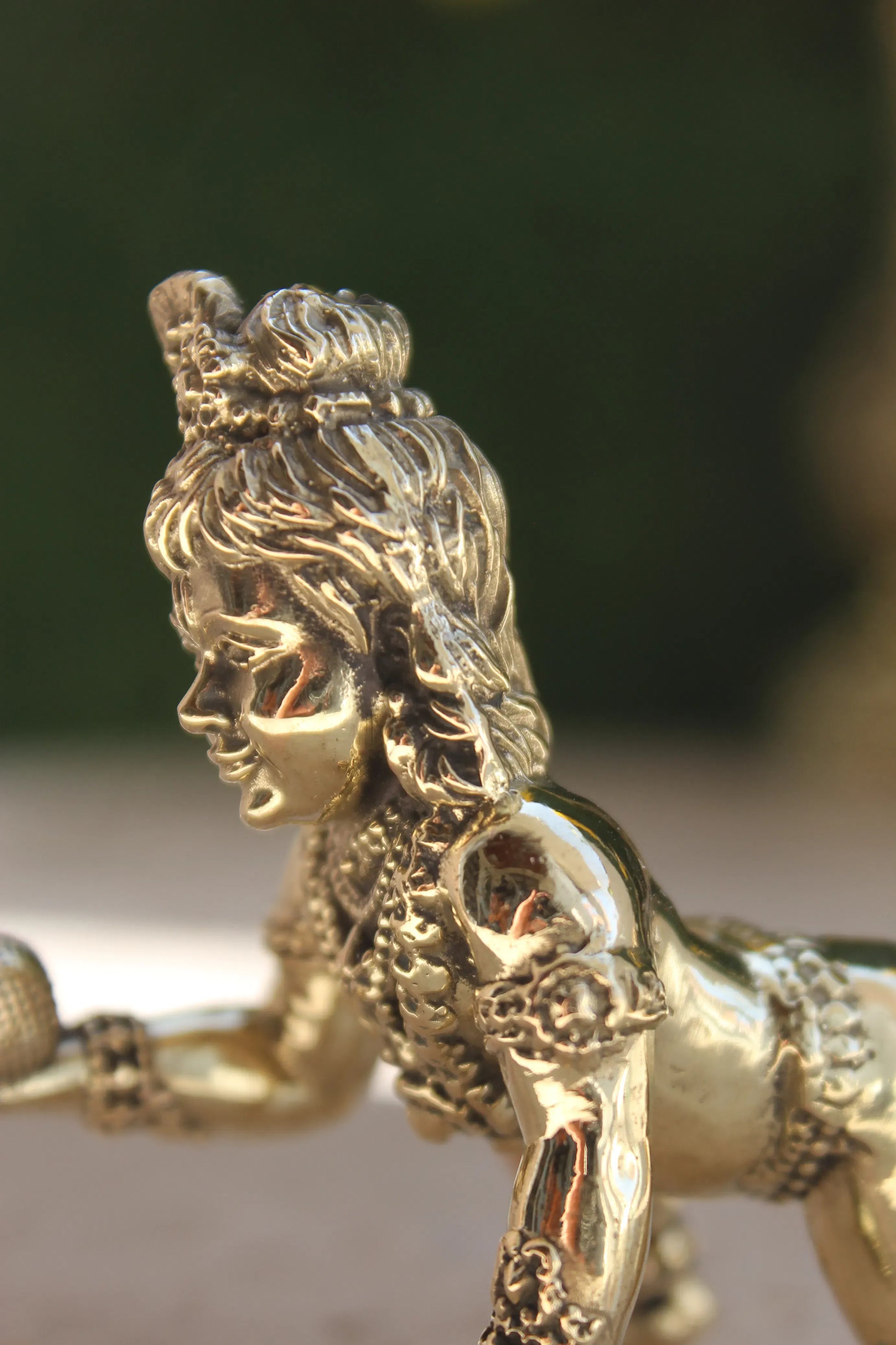 Brass Laddu Gopal Idol playing and crawling pose showing full body with sacred Laddu in hand