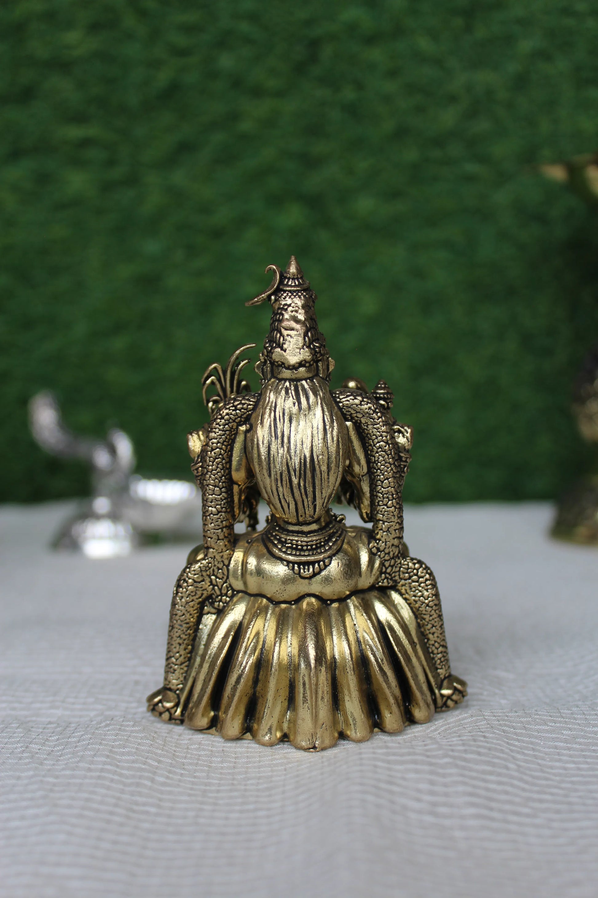 Back view of Kamakshi Mata brass murti showing detailed rear carving and lotus pedestal – handmade Indian religious brass idol