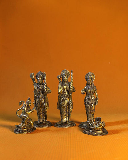 Rigvedaa	rade	rade Ram Darbar idol set in antique brass, featuring Ram, Sita, Lakshman, and Hanuman. 7-inch tall.