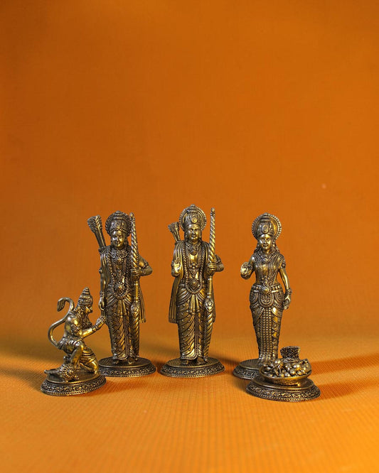 Rigvedaa	rade	rade Ram Darbar idol set in antique brass, featuring Ram, Sita, Lakshman, and Hanuman. 7-inch tall.