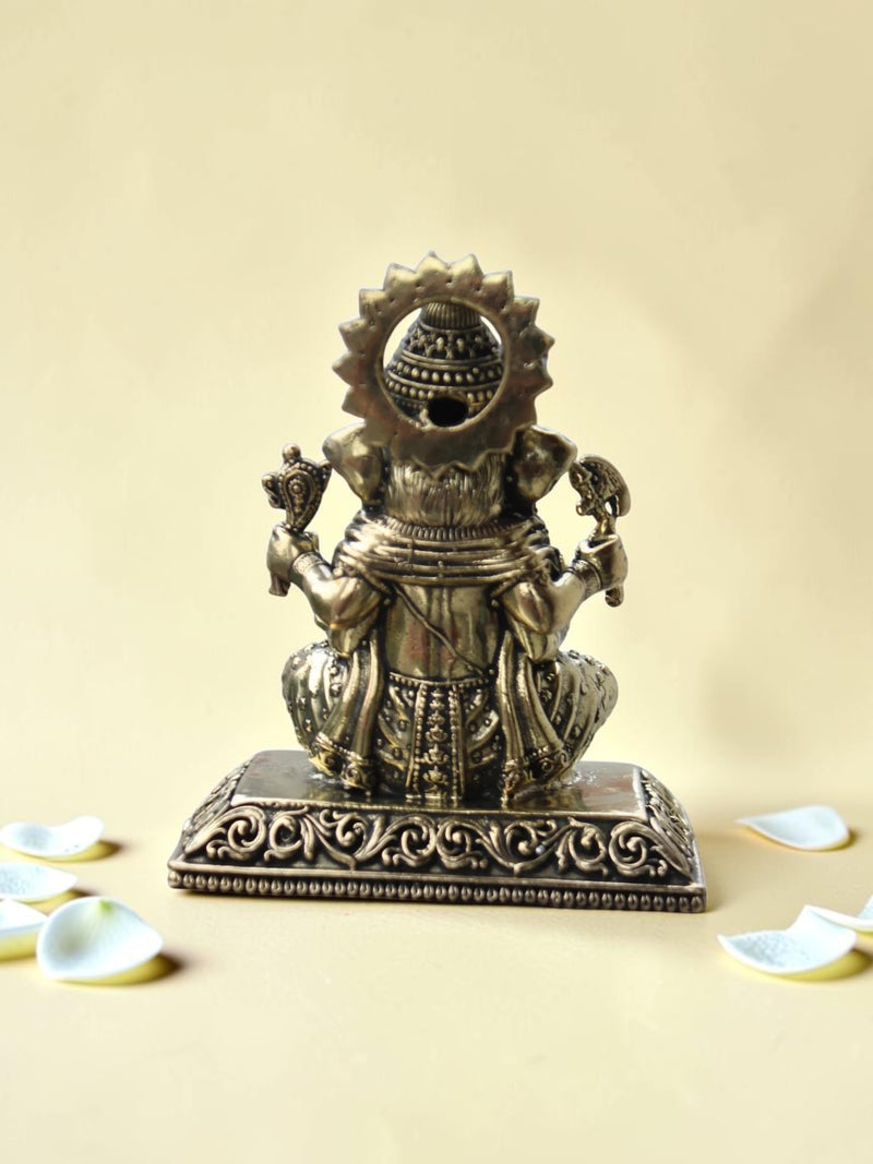 Rigvedaa™ antique gold finish Lord Ganesha idol figurine showing intricate back detailing on a neutral background