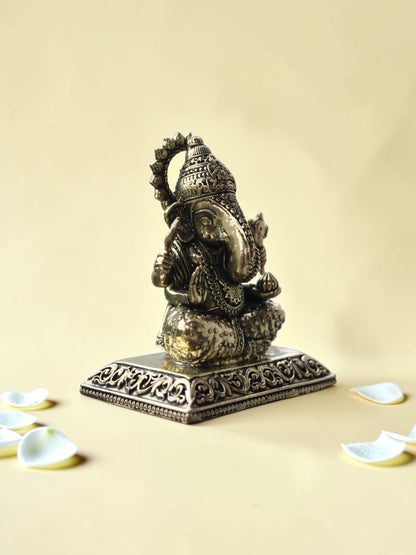 Rigvedaa™ antique gold finish Lord Ganesha idol with intricate engravings on a rectangular pedestal