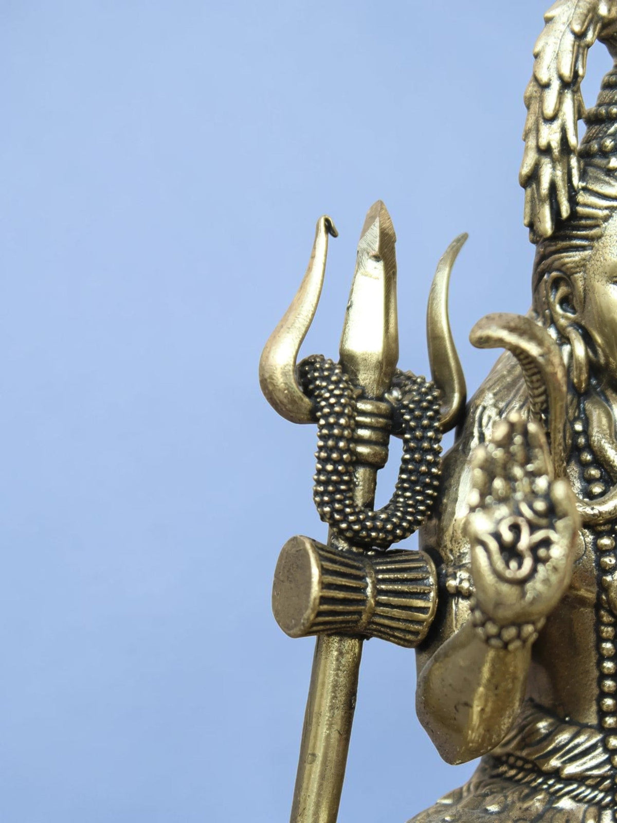Rigvedaa™ antique gold Lord Shiva idol featuring a detailed trishul and serpent, perfect for home meditation decor.