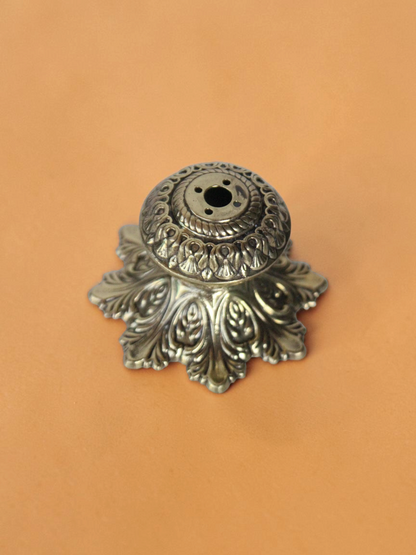 Rigvedaa™ handcrafted solid brass agarbatti stand with an intricate floral petal base and antique golden finish.