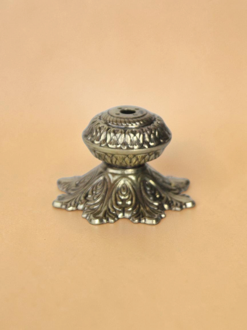 Rigvedaa™ handcrafted solid brass agarbatti stand with an intricate floral petal base and antique golden finish.