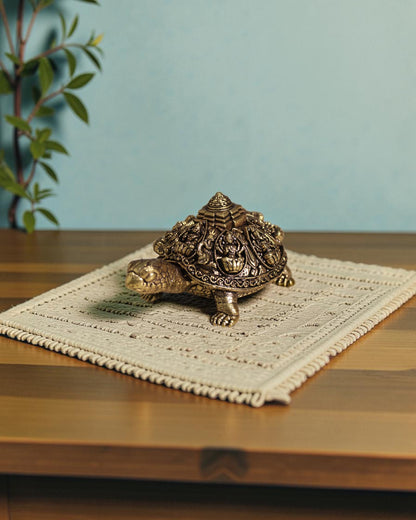 Rigvedaa brass Ashta Lakshmi tortoise with Shree Yantra, intricate carvings, golden patina, Vastu Feng Shui decor.