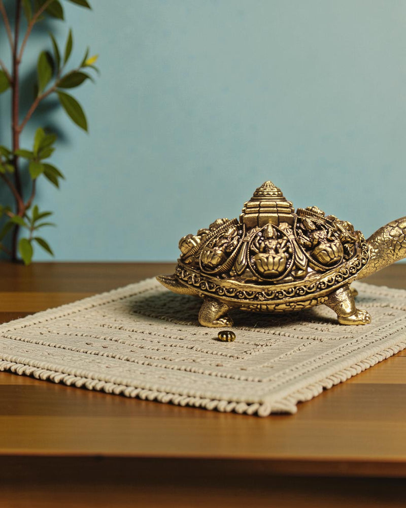 Rigvedaa brass Ashta Lakshmi tortoise with Shree Yantra, intricate carvings, golden patina, Vastu Feng Shui decor.