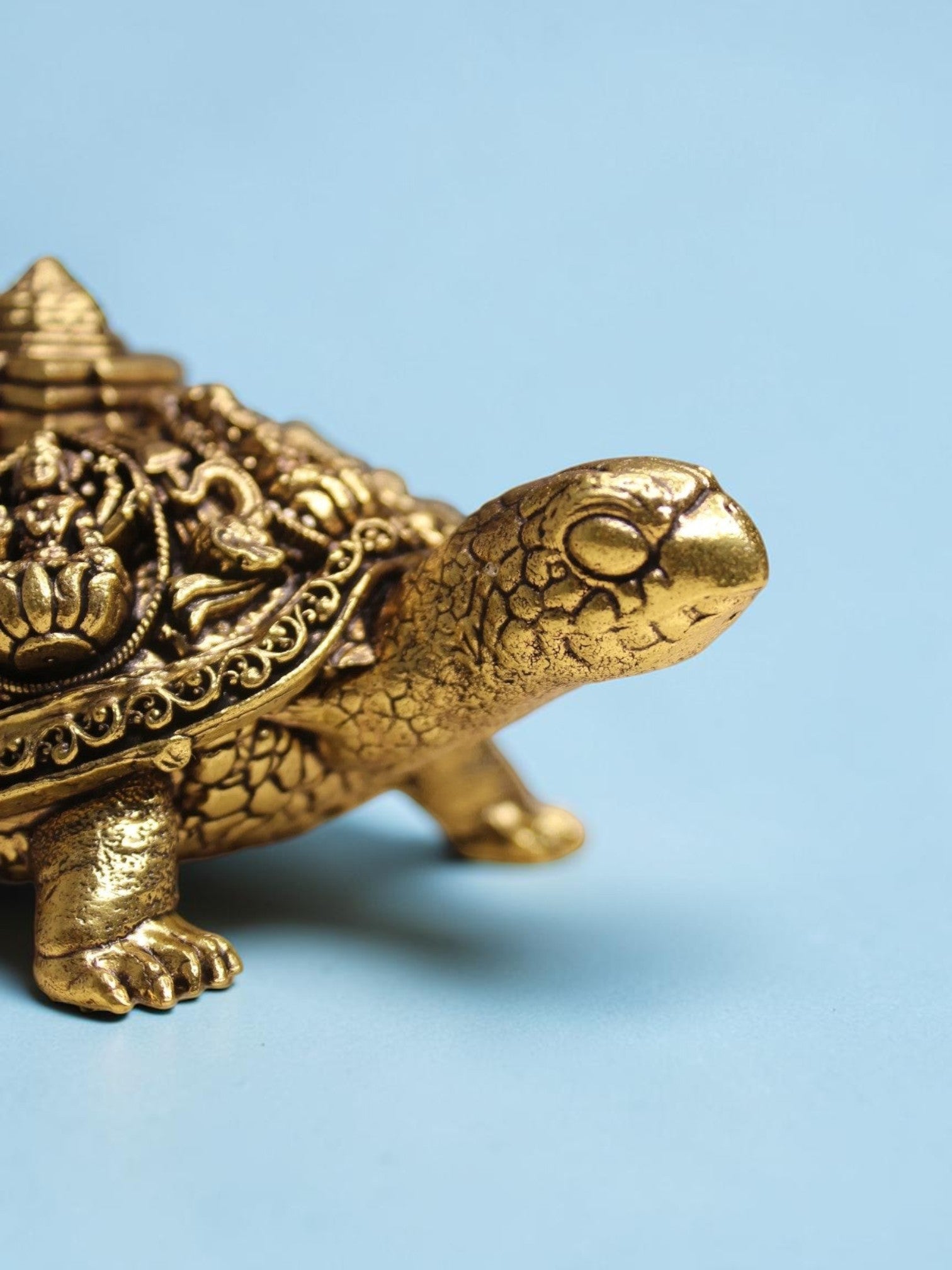 Rigvedaa™ brass Ashta Lakshmi tortoise figurine with intricate Shree Yantra engravings and a warm golden patina.