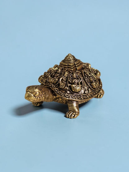 Rigvedaa™ brass Ashta Lakshmi tortoise figurine featuring intricate engravings of Goddess Lakshmi and a central Shree Yantra