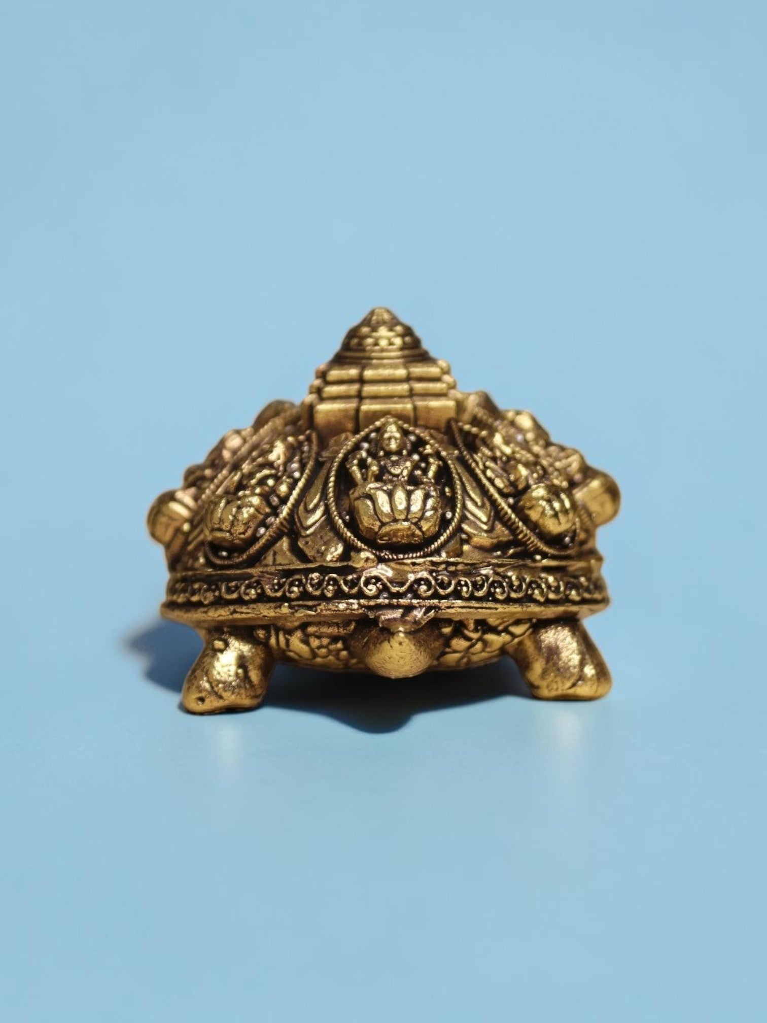Rigvedaa™ brass Ashta Lakshmi tortoise featuring an engraved Shree Yantra on its shell with a warm golden patina.