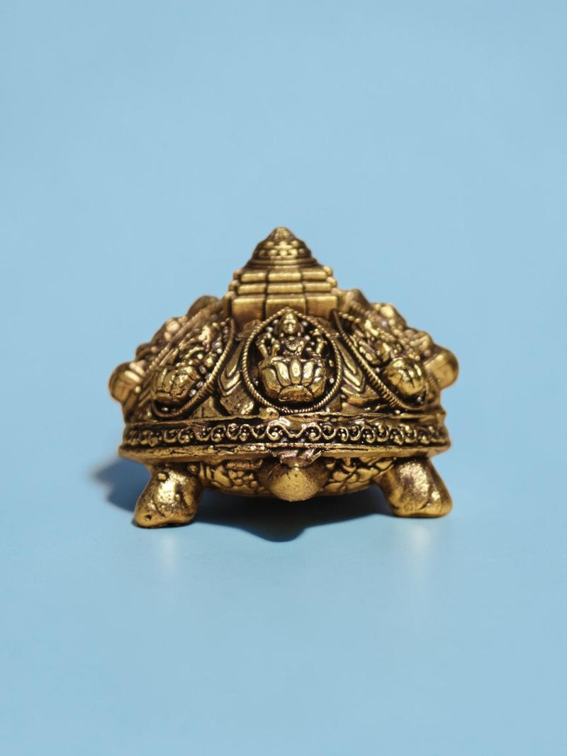 Rigvedaa™ brass Ashta Lakshmi tortoise featuring an engraved Shree Yantra on its shell with a warm golden patina.