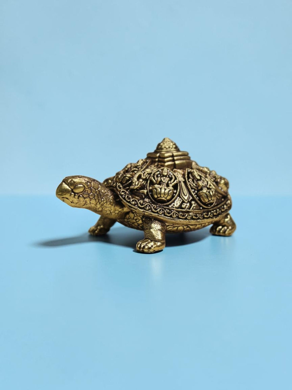 Rigvedaa™ brass Ashta Lakshmi tortoise figurine with intricate Shree Yantra shell engravings and golden patina finish.