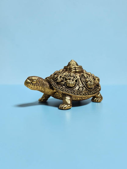 Rigvedaa™ brass Ashta Lakshmi tortoise figurine with intricate Shree Yantra shell engravings and golden patina finish.