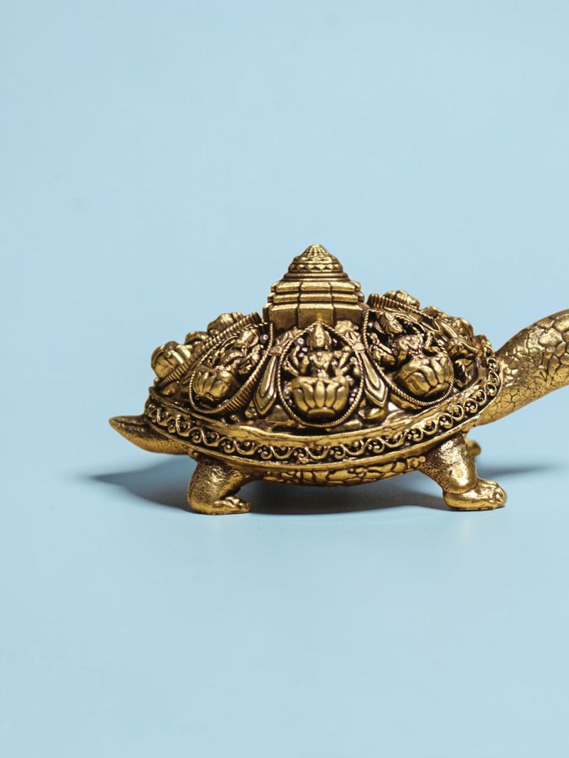 Rigvedaa™ brass Ashta Lakshmi tortoise figurine with intricate Shree Yantra shell engravings and golden patina finish.
