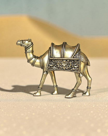 Rigvedaa™ brass desert camel statue with intricate saddle details, a symbol of Rajasthani heritage and good fortune.