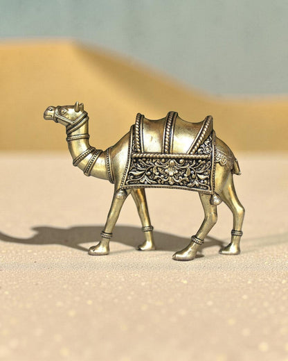 Rigvedaa™ brass desert camel statue with intricate saddle details, a symbol of Rajasthani heritage and good fortune.