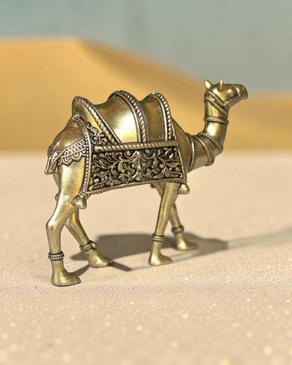 Rigvedaa™ brass desert camel statue with intricate traditional saddle detailing and golden finish, symbol of Rajasthani heritage.