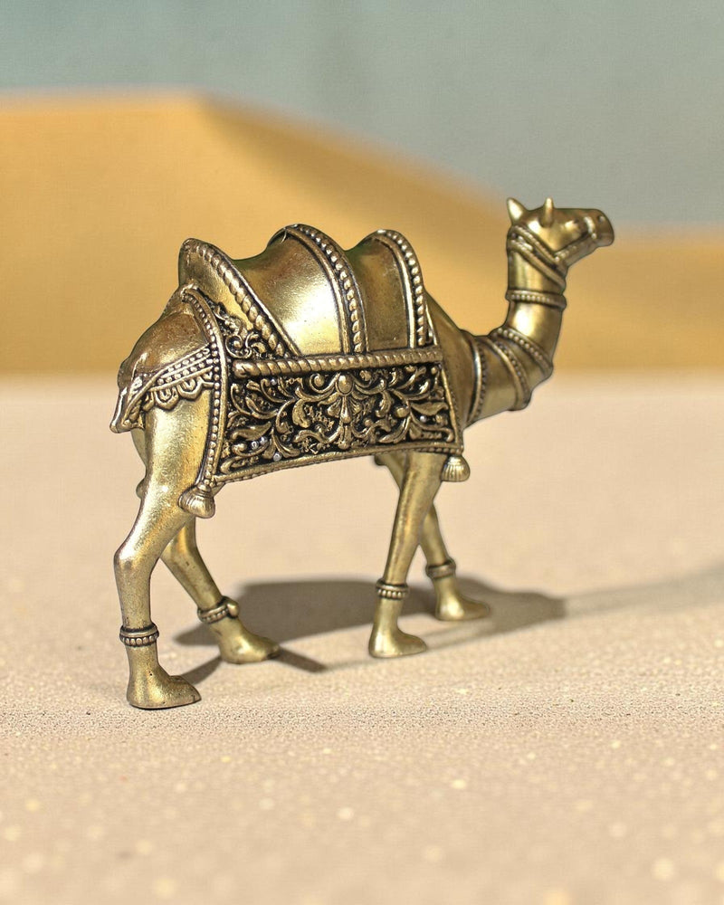 Rigvedaa™ brass desert camel statue with intricate traditional saddle detailing and golden finish, symbol of Rajasthani heritage.