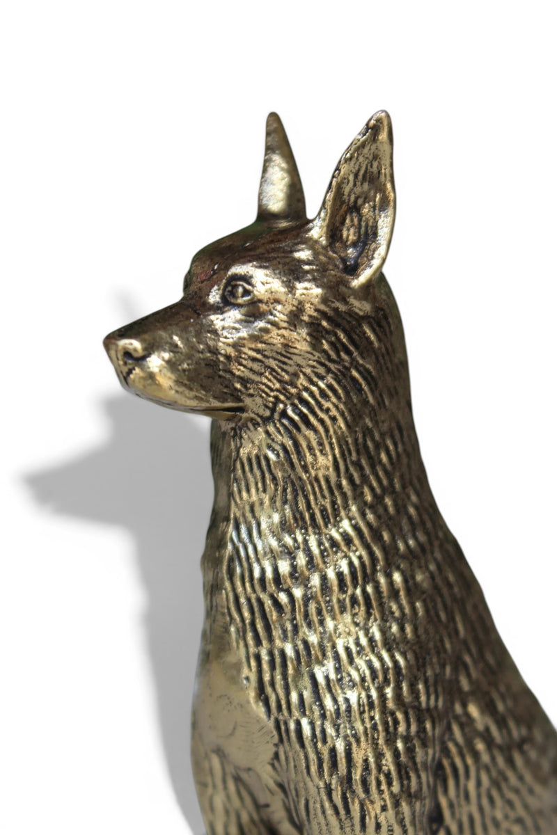 Rigvedaa™ brass dog idol, golden finish, sitting alertly, symbolizing loyalty and protection.
