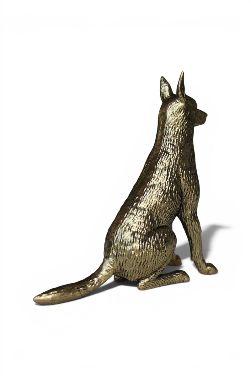 Rigvedaa™ solid brass dog idol, sitting alert with a golden finish. Symbolizes loyalty and protection.