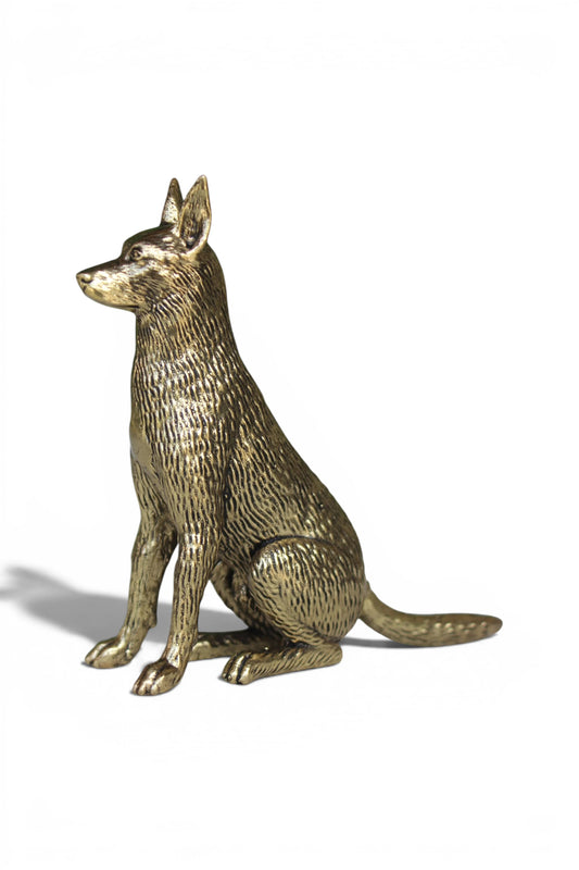 Rigvedaa™ brass dog idol, sitting alert with golden finish. Symbolizes loyalty and protection.