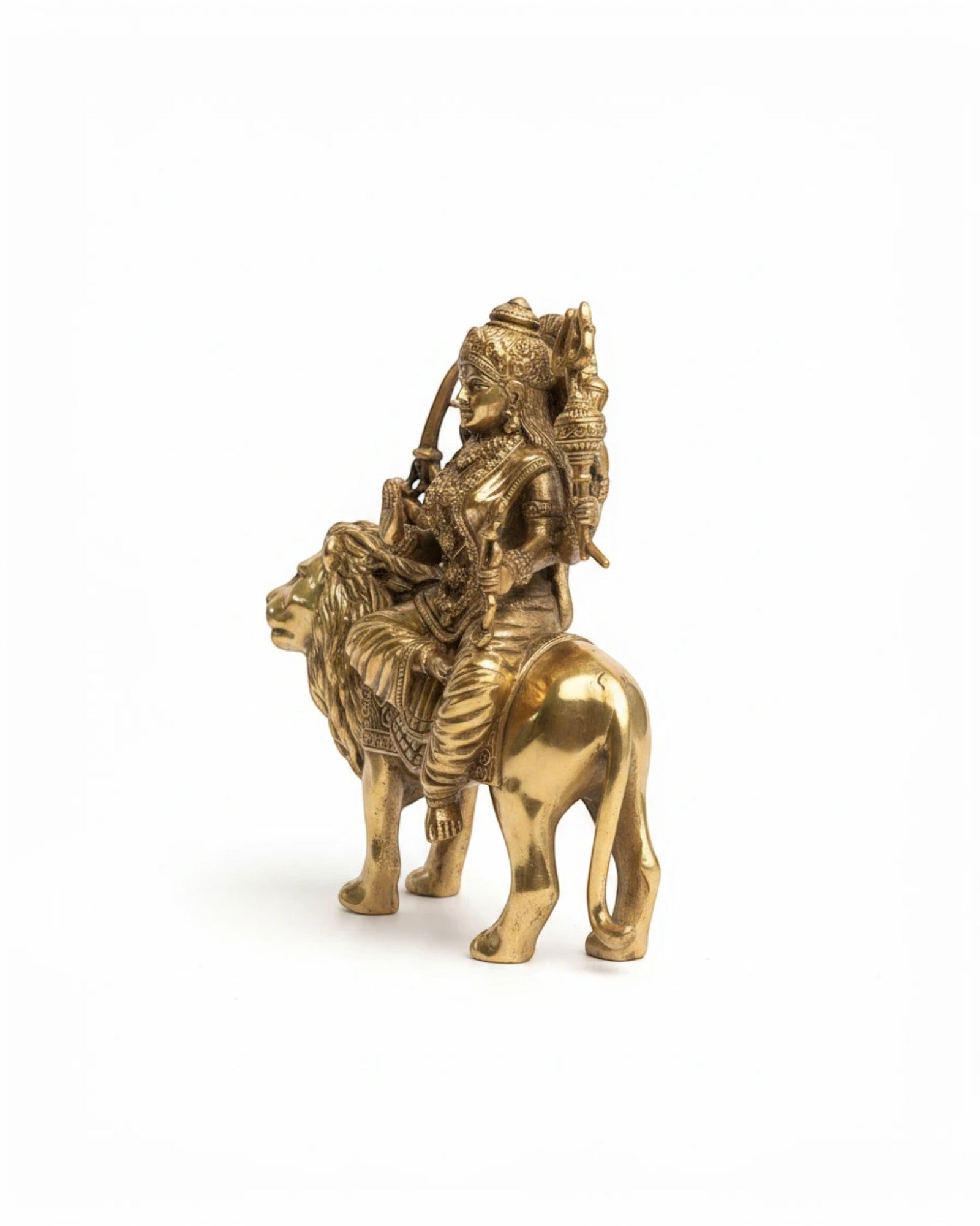 Rigvedaa™ brass Durga seated on lion murti with multiple arms, holding weapons, in Abhaya Mudra. Golden patina.