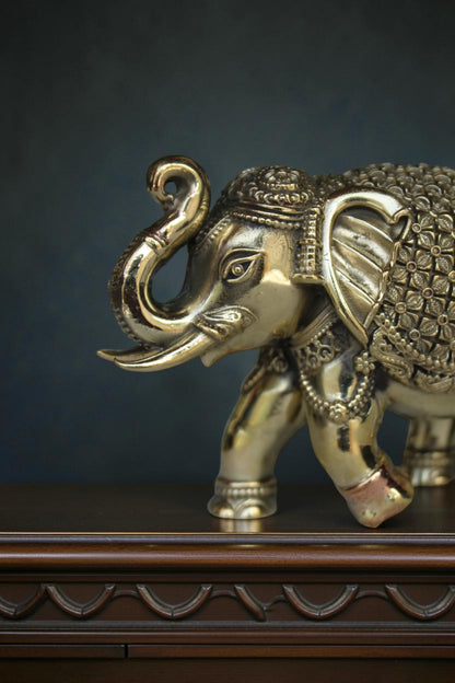 Rigvedaa™ handcrafted brass elephant showpiece with intricate detailing, antique gold finish, symbolizing prosperity and wisdom.