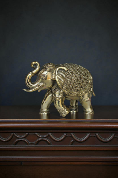 Rigvedaa™ antique gold brass elephant showpiece with intricate detailing on its blanket and jewelry. Symbolizes prosperity.