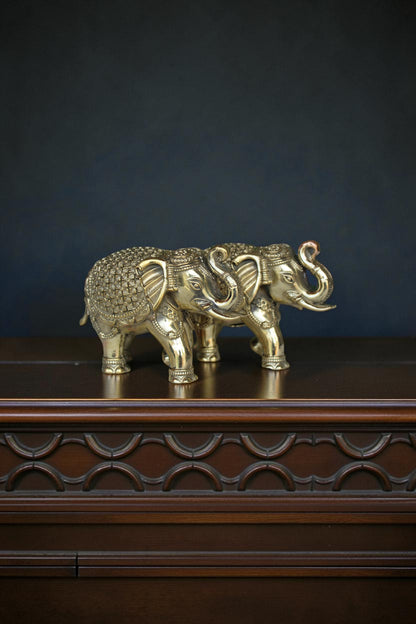 Rigvedaa™ pair of antique gold brass elephants, intricately detailed, symbolizing strength and prosperity for Vastu and Feng Shui.