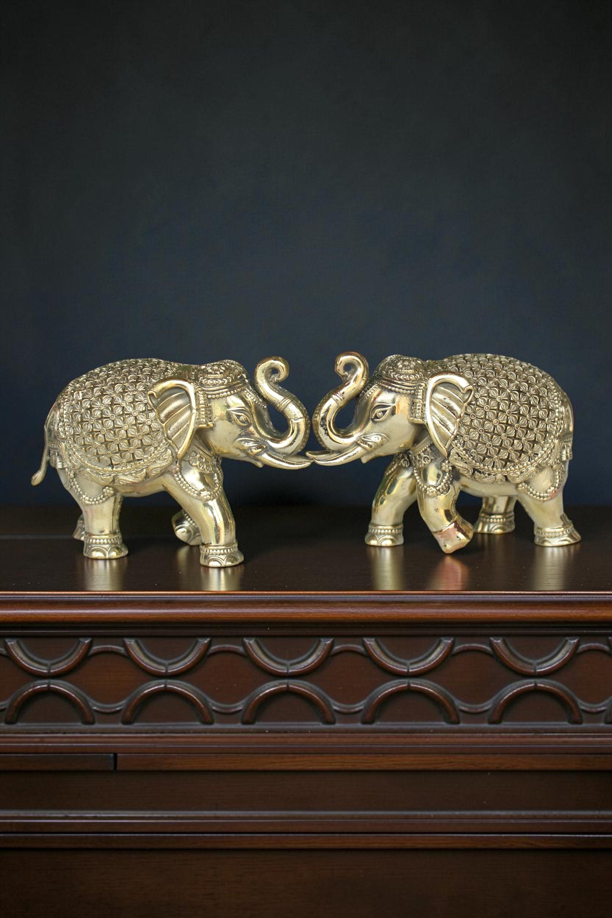 Rigvedaa™ pair of antique gold brass elephants with intricate detailing, symbolizing prosperity and wisdom.