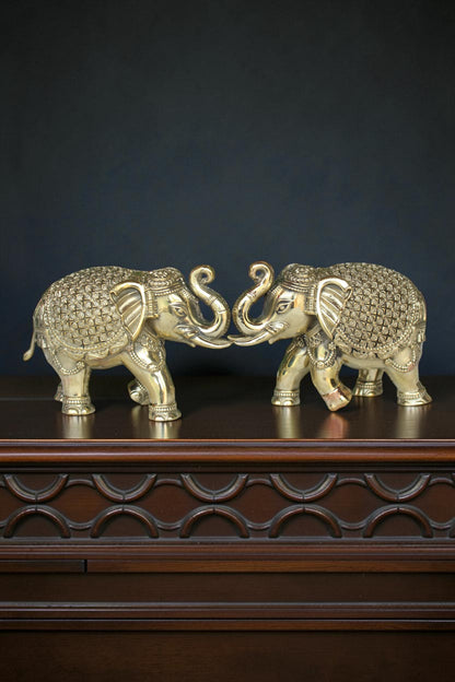 Rigvedaa™ pair of antique gold brass elephants with intricate detailing, symbolizing prosperity and wisdom.