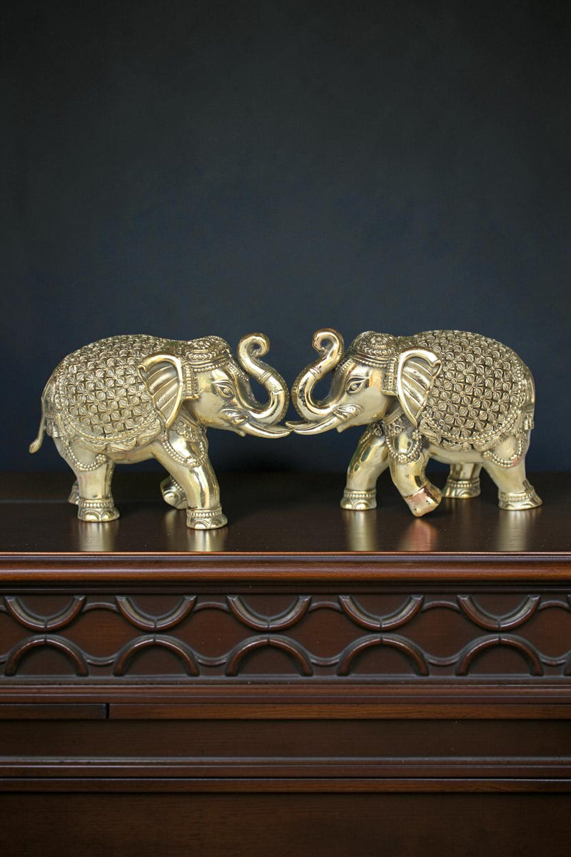 Rigvedaa™ pair of antique gold brass elephants with intricate detailing, symbolizing prosperity and wisdom.