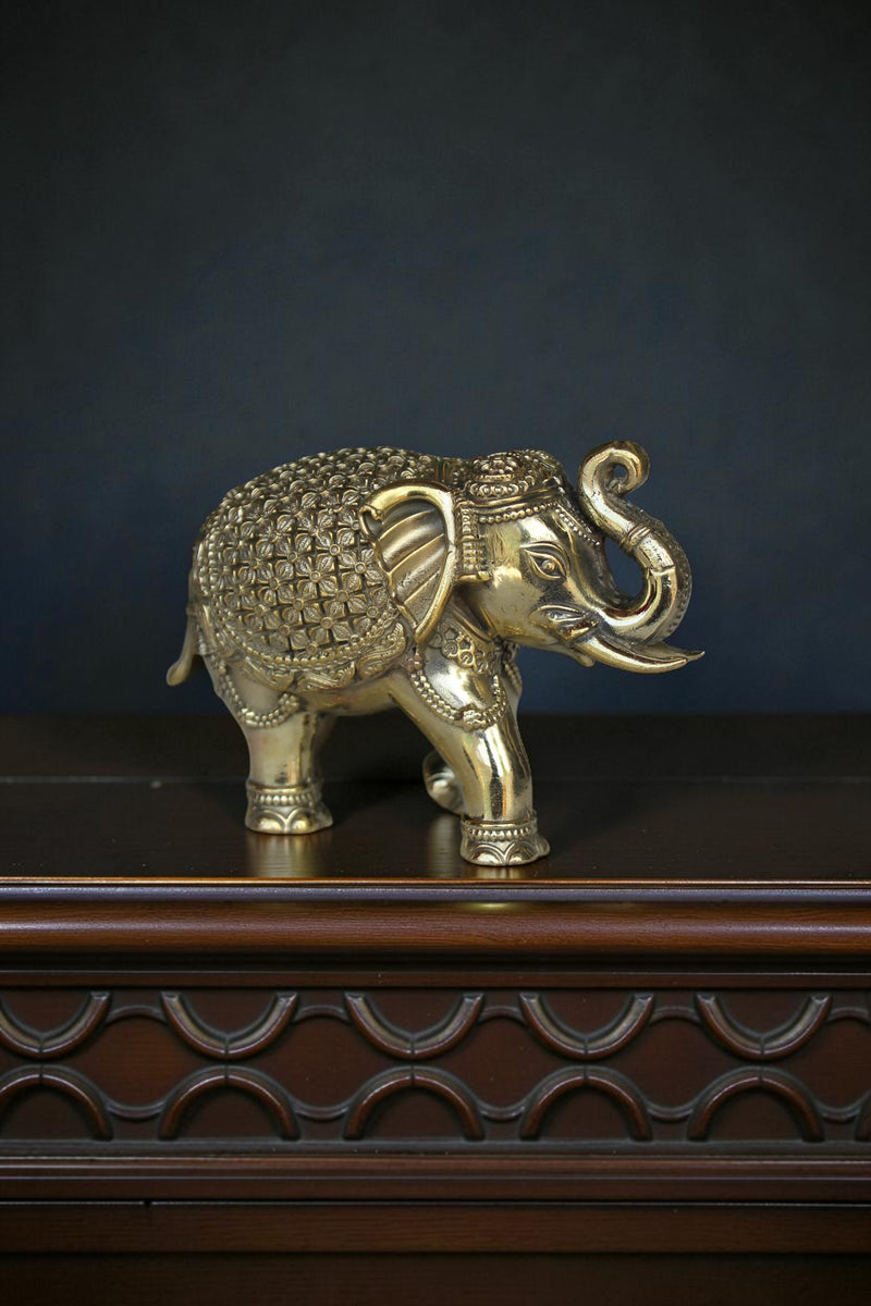 Rigvedaa™ handcrafted brass elephant showpiece with intricate detailing, antique gold finish, Vastu & Feng Shui decor.