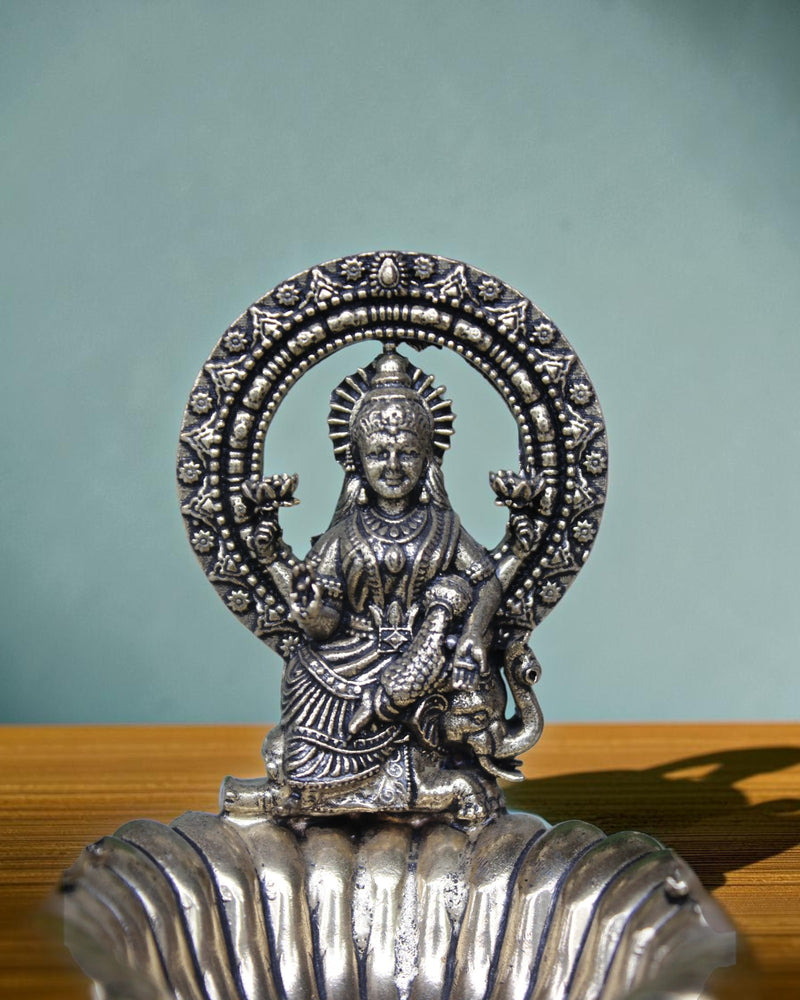 Rigvedaa	raderass Gaj Laxmi diya oil lamp with intricate details, 4.5 inches, antique finish.