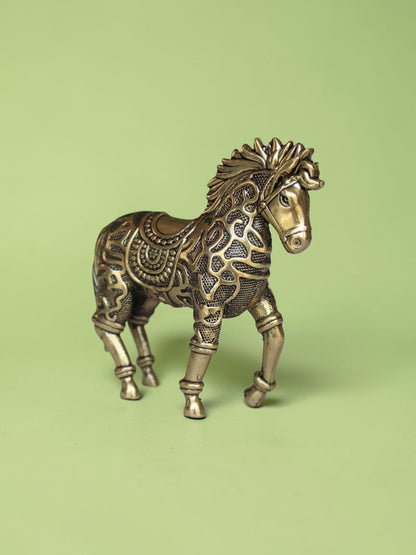 Rigvedaa™ 3.75-inch brass galloping horse statue with intricate traditional relief patterns and a warm golden patina.