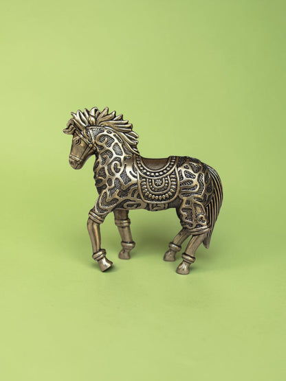 Rigvedaa™ 3.75-inch brass galloping horse statue with intricate traditional relief patterns and a warm golden patina.