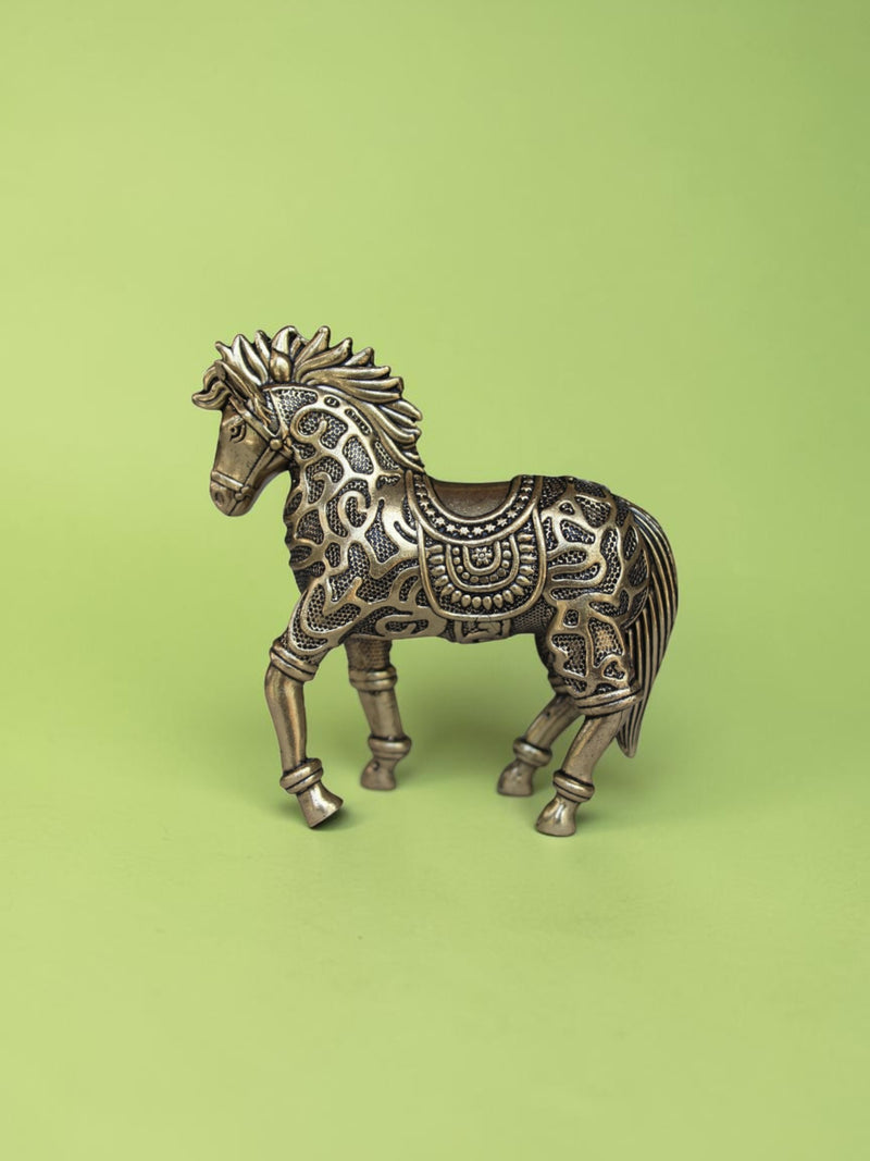 Rigvedaa™ 3.75-inch brass galloping horse statue with intricate traditional relief patterns and a warm golden patina.