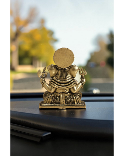 Rigvedaa™ brass Ganesha idol with intricate details, seated pose, holding axe and trident. For car dashboard.