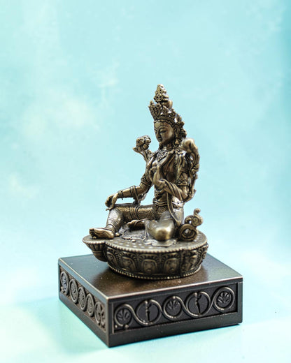 Rigvedaa™ brass statue of seated Goddess Tara in Varada Mudra on lotus throne, detailed crown and jewelry.