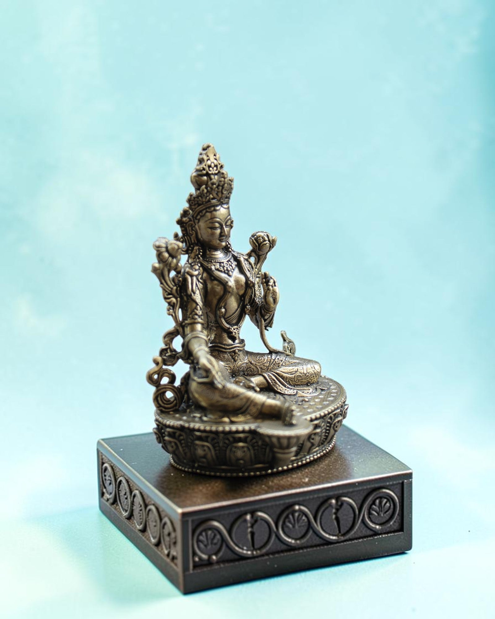Rigvedaa™ brass statue of seated Goddess Tara in Varada Mudra on lotus throne, detailed crown and jewelry, warm golden patina.
