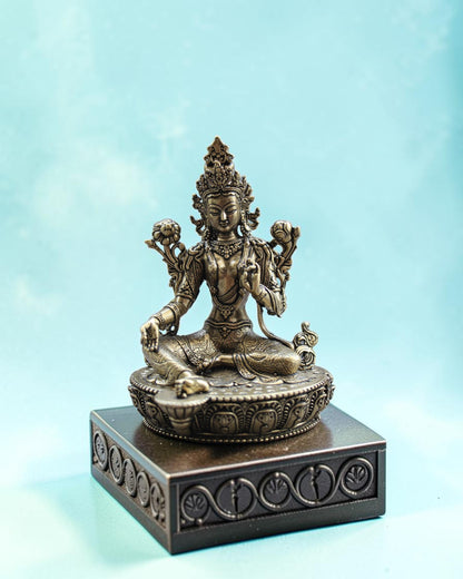 Rigvedaa™ brass statue of Goddess Tara seated in meditation on a lotus throne, right hand in boon-granting gesture, left holding lotus.