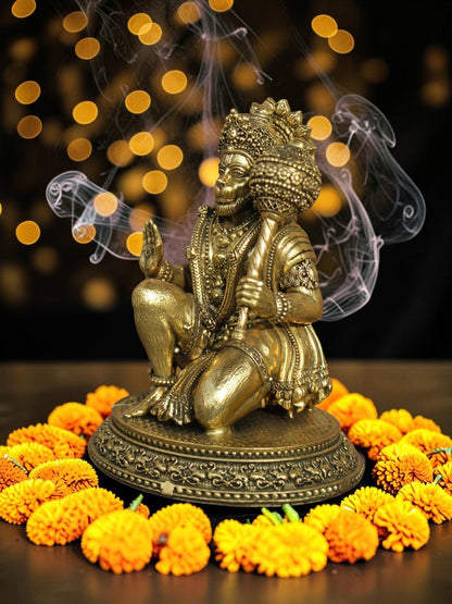 Rigvedaa™ brass Lord Hanuman idol in Ashirwad mudra, featuring intricate carvings and antique gold finish with marigolds