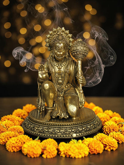 Rigvedaa™ brass Lord Hanuman idol in Ashirwad mudra, featuring intricate carvings and antique gold finish on marigolds.