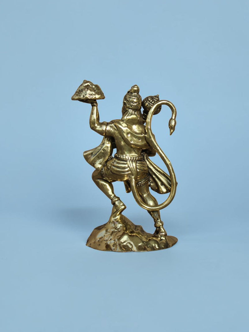 Rigvedaa™ brass Lord Hanuman idol showing the deity carrying the Dronagiri mountain and mace from a rear view.