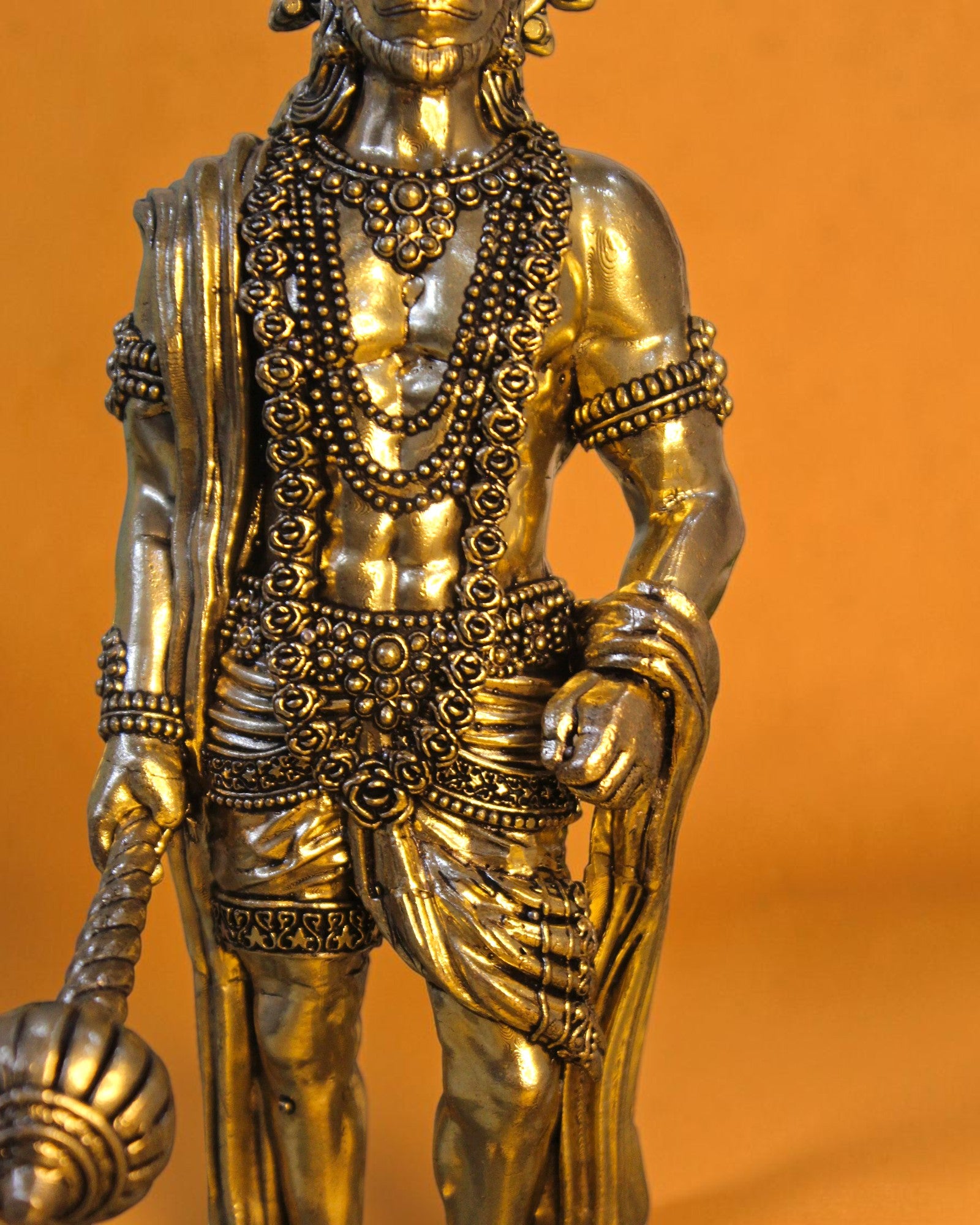 Rigvedaa brass standing Hanuman idol with Gada, 10-inch, detailed jewelry and attire, golden patina.