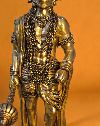 Rigvedaa brass standing Hanuman idol with Gada, 10-inch, detailed jewelry and attire, golden patina.