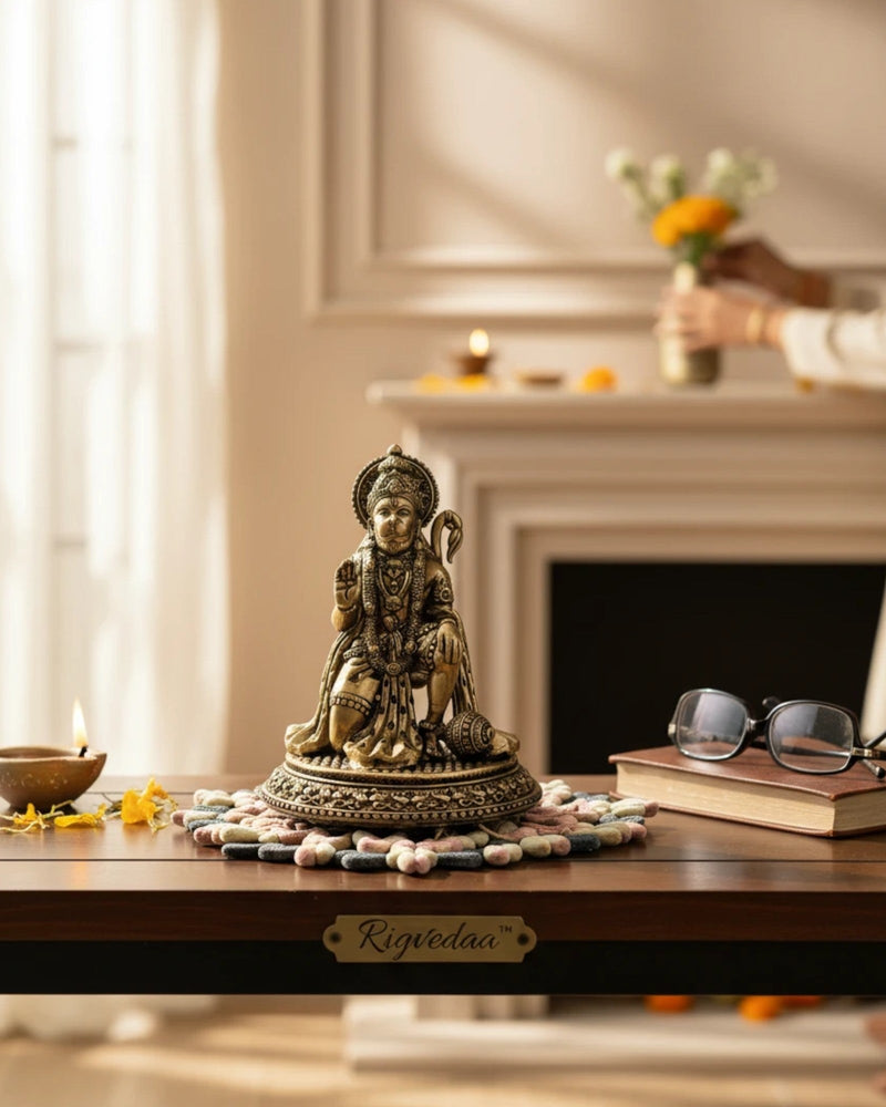 Rigvedaa brass Hanuman Ji statue in blessing pose with mace, detailed traditional attire and warm golden patina.