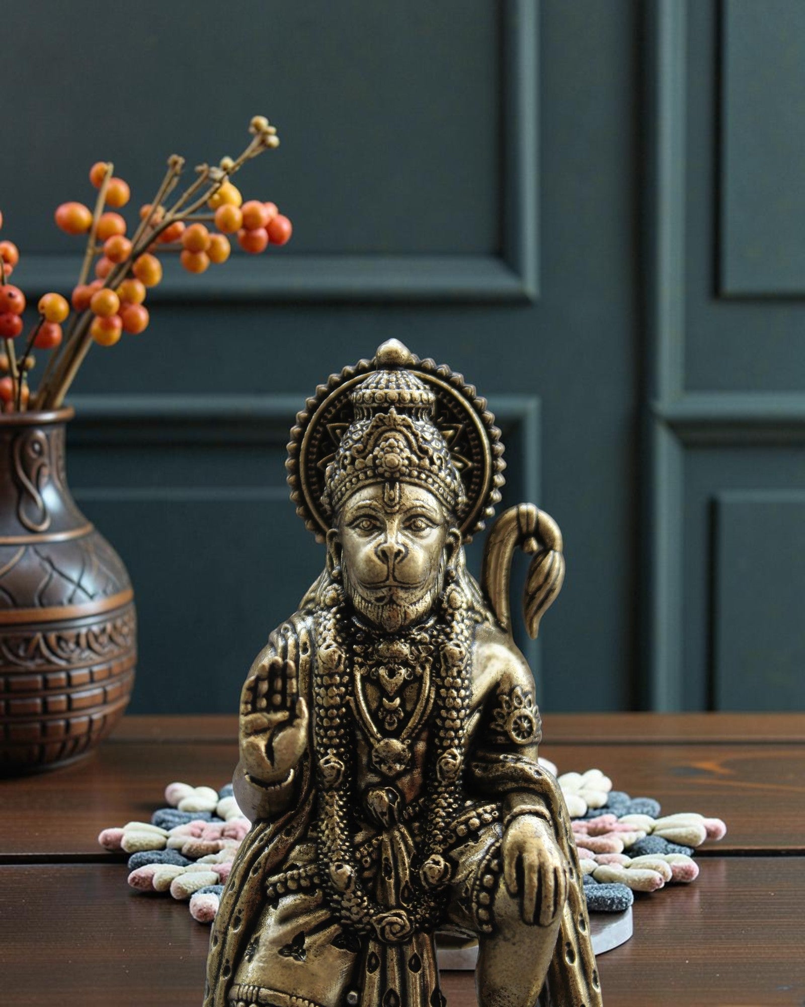 Rigvedaa™ brass Hanuman Ji statue in blessing pose, seated Bajrangbali with mace, intricate details, golden patina.